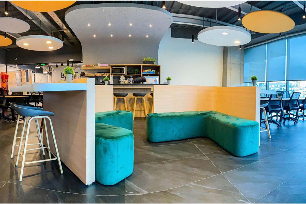 Empty coworking space modern office room. Building facility desk and table. Business community center architecture interior and design area.
